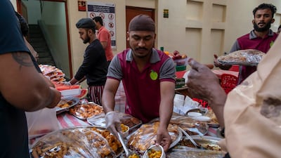 Street vendors prepare and sell food for iftar in Deira.