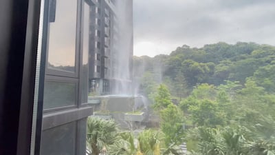Debris falls from a building in New Taipei City. Reuters