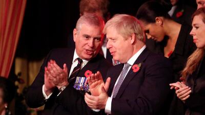 Prince Andrew, Duke of York, and Prime Minister Boris Johnson talk in the royal box. AFP