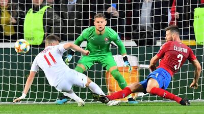 Czech Republic's Ondrej Celustka (r) stops England's Mason Mount (L) in front of Czech Republic's goalkeeper Tomas Vaclik during the UEFA Euro 2020 qualifier Group A football match Czech Republic v England at the Sinobo Arena. AFP