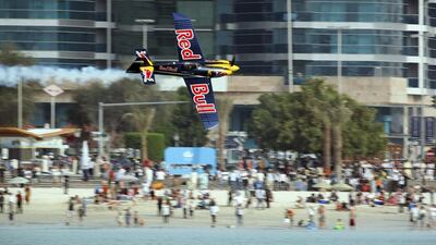 One of the competitors, Peter Besenyei, screams across the Corniche in the last Red Bull Air Race in Abu Dhabi in 2010. Sammy Dallal / The National
