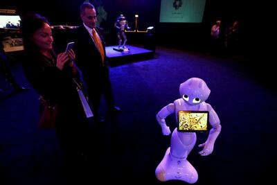 A visitor takes pictures of a robot during an exhibition on 'Neom', a new business and industrial city, in Riyadh, Saudi Arabia. Faisal Al Nasser / Reuters