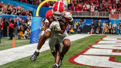 Georgia's Adonai Mitchell makes a touchdown catch against Ohio State's Denzel Burke during the Peach Bowl college football semi-final game in Atlanta. AP Photo