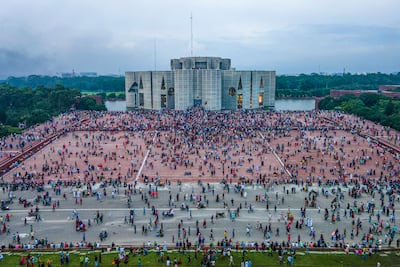 Crowds gather around the Bangladesh Parliament House in Dhaka on August 5 following Prime Minister Sheikh Hasina's resignation. EPA