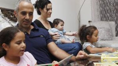Ghaith Sabbagh, his wife, Dana, and their daughters, Meryam, Dina and Leila, enjoy some reading time. Mr Sabbagh believes that there has been a renaissance of Arabic-language books.
