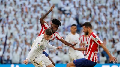 Atletico Madrid's Felipe vies for the ball with Real Madrid's Federico Valverde at the Santiago Bernabeu. Reuters