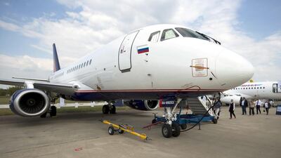 People queue to enter a Sukhoi Superjet 100, one of Russia's showcase aircraft on display at MAKS 2015. Pavel Golovkin / AP Photo