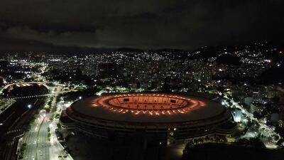 The Maracana stadium is seen illuminated with golden lights to honour Pele. Reuters