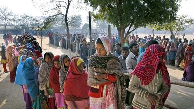 Indians wait in a queue to cast their votes at a polling booth in New Delhi, India on February 7, 2015. Manish Swarup/AP Photo