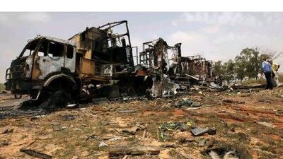 Nato warplanes struck Tripoli several times on Tuesday in a sustained bombardment. Locals inspected the aftermath yesterday. Ahmed Jadallah / Reuters