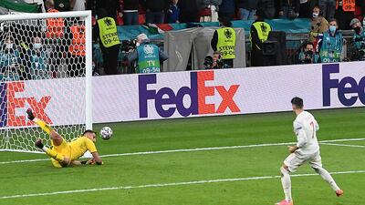 Italy goalkeeper Gianluigi Donnarumma saves Alvaro Morata's penalty in the shootout.