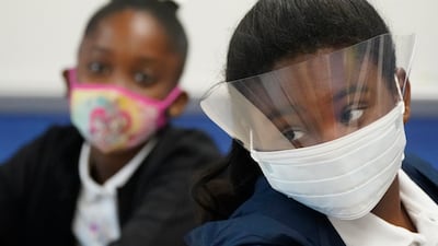Fifth-grade students wearing masks to help prevent the spread of Covid-19, listen during class, on August 10, 2021, during the first day of school at Washington Elementary School in Riviera Beach, Florida. AP