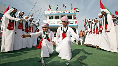 Dancers perform during a marine show on the Dubai Creek.