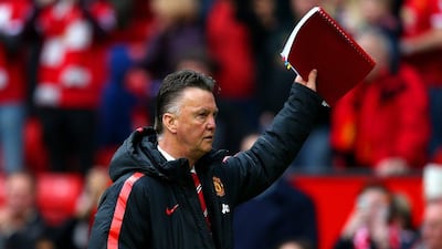 Manchester United manager Louis van Gaal waves to the crowd after his side's Premier League win over Aston Villa on Saturday. Alex Livesey / Getty Images / April 4, 2015