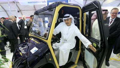 Saif Ahmed Alghfeli, chief executive at Al Hosn Gas, looks at the explosion-proof vehicle after the launch by United Safety International and Al Hosn Gas at Adipec 2014. Ravindranath K / The National