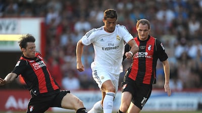 Bournemouth's Harry Arter, left, tackles Real Madrid's Cristiano Ronaldo during the pre-season friendly at the Goldsands Stadium, Bournemouth. Getty
