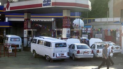 Egyptians queue at a petrol station in Cairo. Mahmoud Khaled / AFP