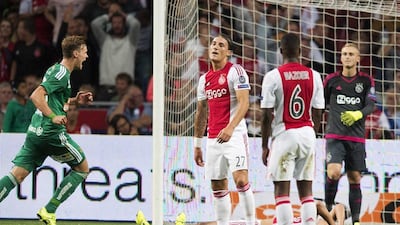 Stefan Stangl, left, of Rapid Vienna celebrates during his team's stunning win over Ajax at the Amsterdam Aerna. Olaf Kraak / EPA