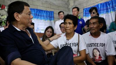 A handout photo made available by the Philippine Presidential Photographs Division shows president Rodrigo Duterte (L) speaking to the parents of Joanna Demafelis during a wake in the town of Sara, Iloilo province, Philippines, on February 22, 2018. EPA