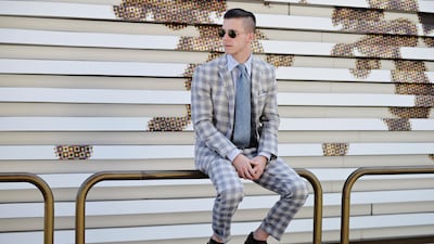 Making his first Pitti appearance, the Thom Browne intern Lance Jubel was, hands-down, the week's best dressed. Right on Day 1 he wore the most dapper of plaid suits - designed by his boss, of course. We suspect Browne sent him to the fair to simply peaco???