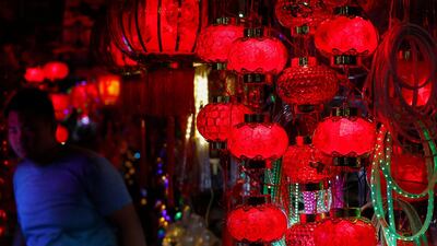 A Cambodian man walks past red lanterns at a store set up for Chinese New Year in Phnom Penh, Cambodia. EPA