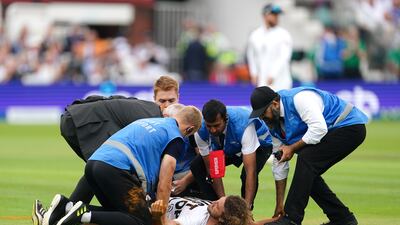 Security detain a Just Stop Oil protester during day one of the second Ashes Test. PA