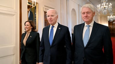 US Vice President Kamala Harris, President Joe Biden and former US president Bill Clinton arrive for an event marking the 30th anniversary of the act. AFP