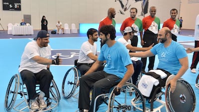 Players, including Sheikh Hamdan bin Mohammed, centre, shake hands after the game. (WAM / April 15, 2014)