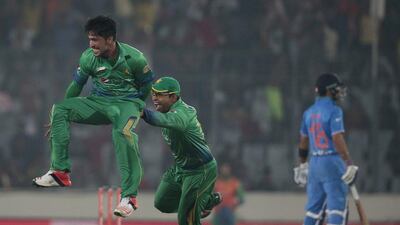 Pakistan’s Mohammad Amir, left, celebrates with his teammates after the dismissal of India’s Suresh Raina, unseen, during the Asia Cup Twenty20 international cricket match between them in Dhaka, Bangladesh, Saturday, Feb. 27, 2016. (AP Photo/A.M. Ahad)