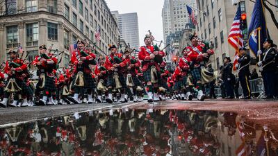 Bagpipers march up Fifth Avenue past St Patrick's Cathedral during the St Patrick's Day Parade in New York. Celebrations across the country are back after a two-year hiatus in a sign of growing hope that the worst of the coronavirus pandemic may be over. AP Photo