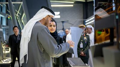 The President tours a booth at Idex, which is hosting about 1,350 companies and 350 delegations this week