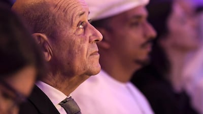 French Foreign Affairs Minister Jean-Yves Le Drian (L) listens to a speech during his visit to Abu Dhabi's Sorbonne University in the Emirati capital, on October 28, 2019. AFP