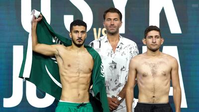 Ziyad Al Maayouf, leftt, and Jose Alatorre with Matchroom promoter Eddie Hearn during the weigh in at the King Abdullah Sport City Stadium in Jeddah, Saudi Arabia on Friday August 19, 2022. PA