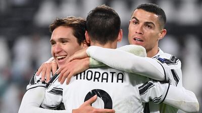 Juventus attacker Alvaro Morata celebrates with Federico Chiesa, left, and Cristiano Ronaldo after scoring during their 3-0 Champions League win over Dynamo Kiev on Wednesday, December 2. AFP