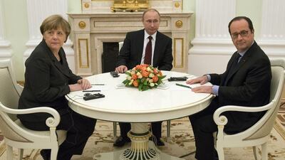 From left: German chancellor Angela Merkel, Russian president Vladimir Putin and French president Francois Hollande met at the Kremlin in Moscow yesterday. Alexander Zemlianichenko / AP Photo