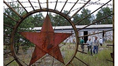Visitors come through a gate of Lychen II. Some would like to see the former top-secret site turned into a museum rather then sold to a private bidder.
