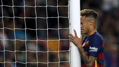 Barcelona's Neymar reacts after missing a goal against Valencia. REUTERS/Albert Gea