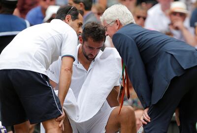 Marin Cilic receives medical attention during the final. Andrew Couldridge / Reuters