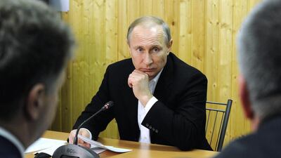 Russian president Vladimir Putin (C) chairs a meeting on the socioeconomic development of Crimea and Sevastopol at the headquarters of the construction of the bridge across the Kerch Strait at Tuzla Island in Russia. Mikhail Klimentyex / Kremlin Pool