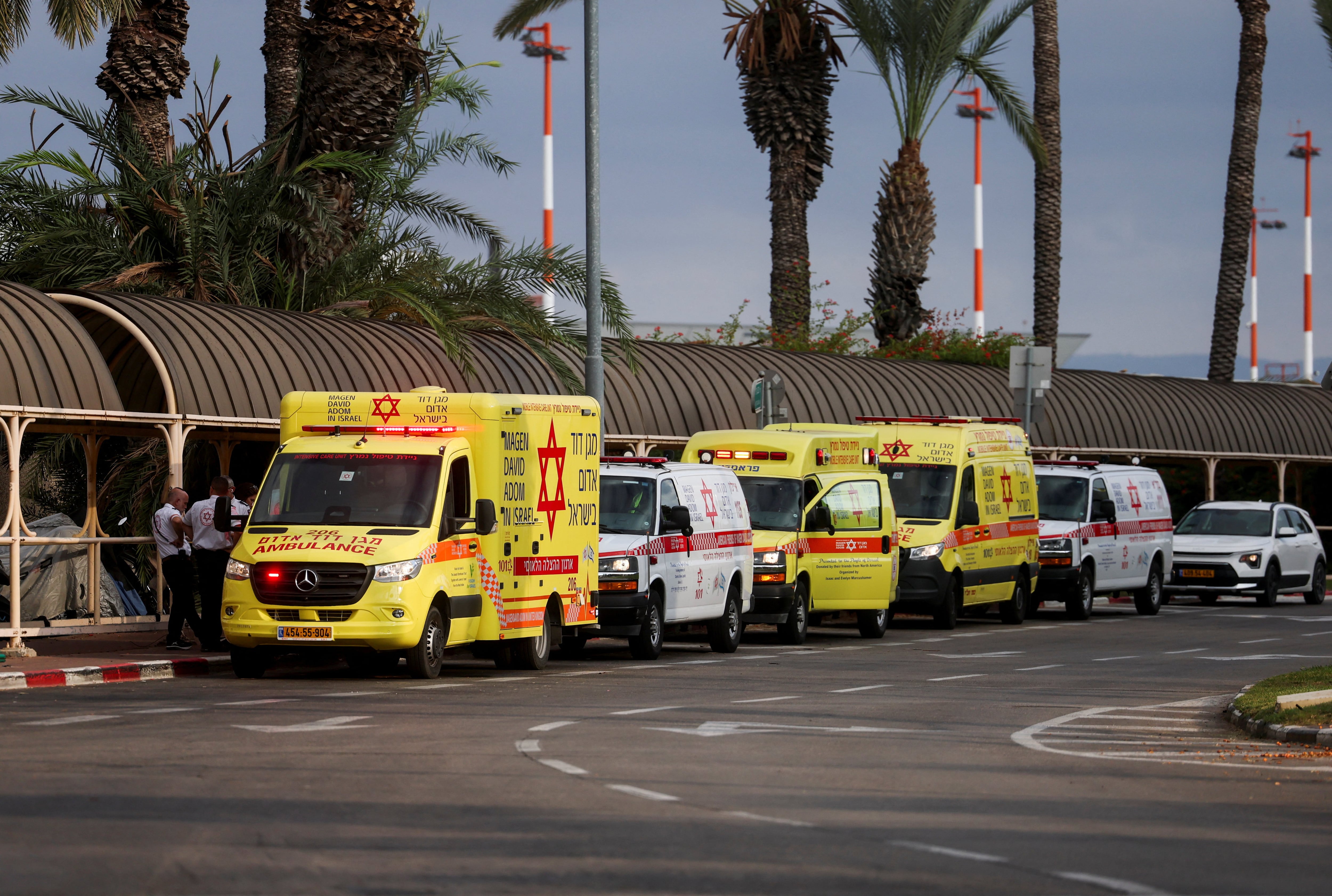 Ambulances are kept at the ready as passengers arrive in Israel on the second flydubai aircraft. Reuters