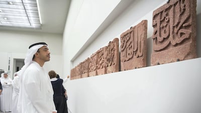 Sheikh Abdullah views the Epigraphic frieze, during a tour of the Louvre Abu Dhabi. Mohamed Al Raeesi / Crown Prince Court - Abu Dhabi