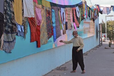 Artwork by visual artist Tara Abdallah in the city of Sulaimaniyah, representing stitched clothes from women who survived domestic violence. AFP