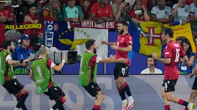 Mikautadze celebrates with his teammates. AP