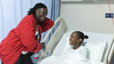 Shanice Baptiste, from Trinidad and Tobago, with her coach Clevanic Williams-Cupid at Sheikh Khalifa Medical Centre. Khushnum Bhandari for The National