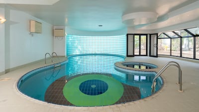 The swimming pool is located in one of two outhouses.