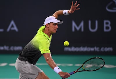 Kevin Anderson of South Africa in action against Spain's Pablo Carreno Busta during their quarter-final match at the Mubadal World Tennis Championship in Abu Dhabi. Martin Dokoupil / EPA