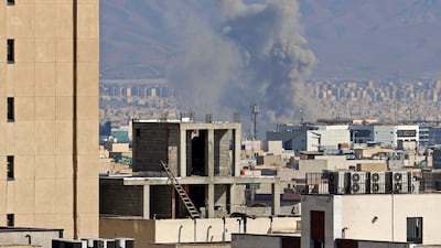 Smoke rises from the site of air strikes in Tehran. AFP