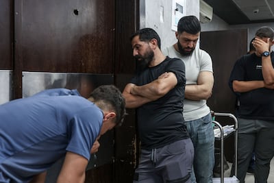 Relatives mourn during the funeral of two Palestinians killed in Al Mughayyir, near Ramallah, at a hospital in the occupied West Bank. AFP