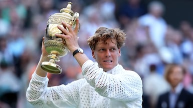 Italy's Jannik Sinner with the Wimbledon trophy after defeating Alexander Zverev of Germany in the final at All England Club. Getty Images
