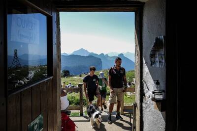 Tourists in Dingy-Saint-Clair, in the French Alps. France is set to drop pre-depature PCR tests for travellers. AFP